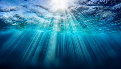 Obraz premium Underwater Light Rays Shining Through Clear Ocean Water Surface Background