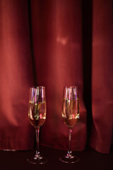 Wine Glasses on Red Curtain Background