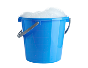 A blue bucket overflows with fluffy white bubbles, isolated on black background