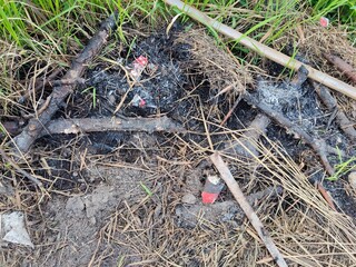 background of the remains of a burning campfire at night