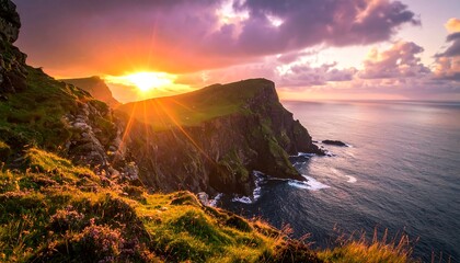 Vibrant sunset over dramatic coastal cliffs