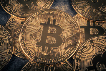 Golden bitcoin on grey background. Cryptocurrency and finance concept.