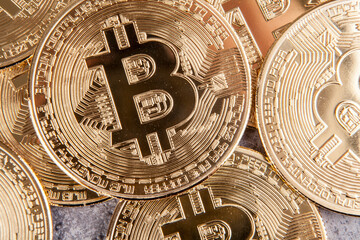 Golden bitcoin on grey background. Cryptocurrency and finance concept.