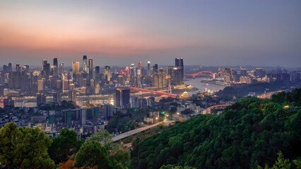 Chongqing Skyline with Illuminated Bridges over Yangtze River at Dusk, China Cityscape from Mountain Hillside