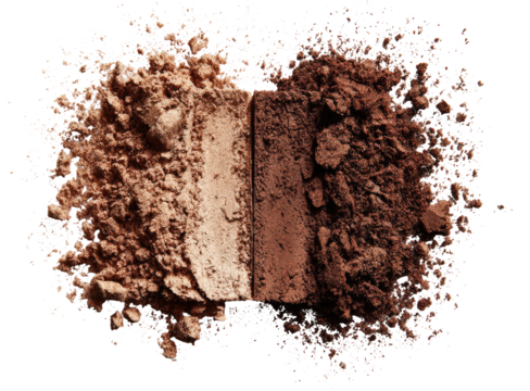 Two shades of brown powder, light and dark, separated, nestled in a cloud of loose powder