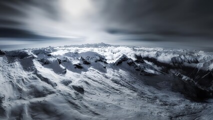 Dramatic Snow-Capped Mountain Peaks Under Stormy Swirling Clouds in High Altitude Wilderness Landscape