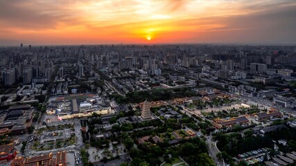 Golden Sunset Over Xi'an China Cityscape with Ancient Pagoda and Modern Architecture Aerial View