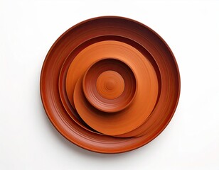 Abstract overhead view of nested concentric reddish-orange bowls on a white surface