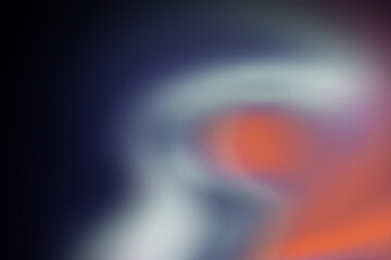 Abstract blurred colorful lights and shapes against a dark, grainy background