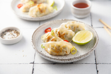 Fried dumplings with chili sauce