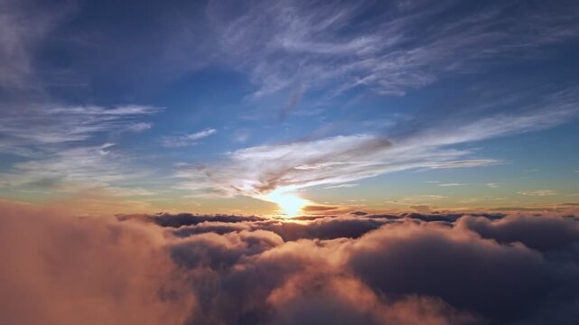 Breathtaking drone footage of sunrise above the clouds with golden light and dramatic skies, perfect for cinematic, travel, and inspirational projects.