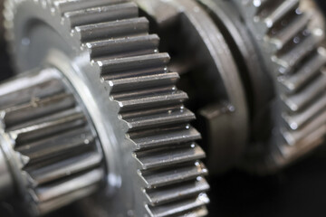 Fototapeta premium Close up of metal gears showing mechanical power and engineering precision, evoking sense of industrial strength and intricate design