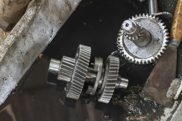 Close up mechanical gears, showing wear and tear, with sense of mechanical complexity and...