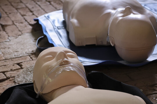 Medical training dummy with open eyes, demonstrating life saving CPR technique. This educational tool offers realistic practice scenario for healthcare professionals to develop critical skills