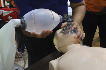 CPR training progress with dummy medical emergency health care resuscitation simulation practice lesson education breathing airway mask equipment assistance help life support saving survival