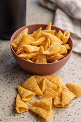 Bugles snack. Cone corn chips on kitchen table.
