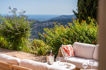 Elegant terrace with sea view and champagne setup in Provence