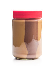 Two-tone nut chocolate spread in jar isolated on white background.