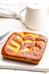 Catalana sponge cake on white table.