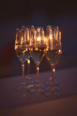 Bubbling celebration captured at sunset with sparkling glasses lined up for a joyful toast among friends and loved ones
