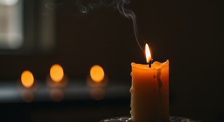 Burning candle with soft flame and smoke in dark room close up