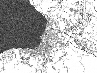 Illustrated city map of Manado, Indonesia, in black and white, showing roads and textures.