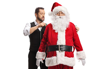 Tailor measuring Santa Claus