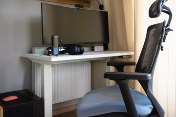 Modern Home Office with Ergonomic Chair and Large Monitor