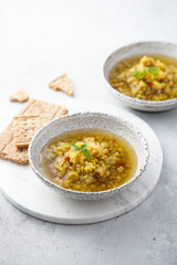 Homemade lentil soup served with basil