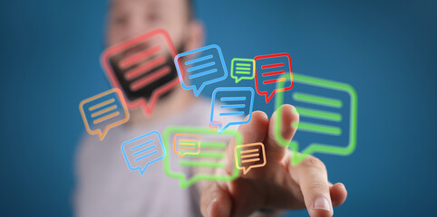 Conceptual shot of floating speech bubbles above a hand, emphasizing modern communication methods and human interaction in digital space.