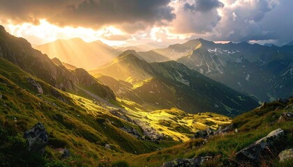 Golden Sunlight Beams over Verdant Mountain Range Under Cloudy Sky Landscape with Green Slopes and Distant Peaks and Dramatic Lighting