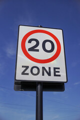 20 mph speed limit sign on residential road in the UK. Speed restriction zone