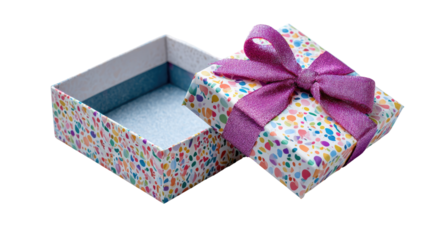 Opened small gift box with a colorful polka dot pattern and a purple ribbon bow