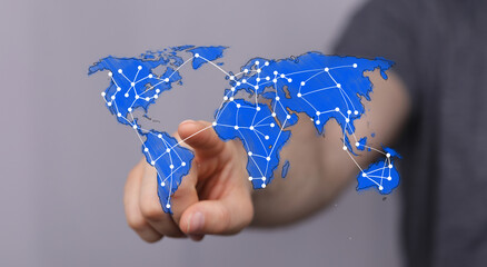 Hand touching a global network map, symbolizing worldwide communication, internet, business, and...