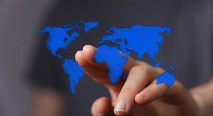 A person's hand pointing at a blue world map outline, representing global connectivity, travel, and international business. Ideal for illustrati