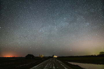 Night sky full of stars. Milky Way above the aurora.
