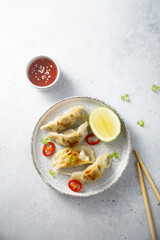 Fried dumplings with chili sauce