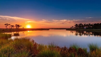 Obraz premium Beautiful Sunset Over The Calm Waters Of Pelican Bay Near Orr