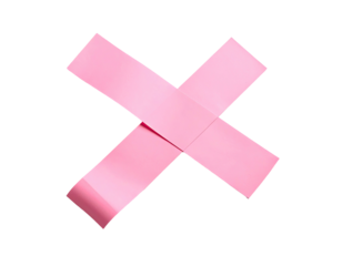 Pink adhesive tape pieces forming a bold "X" against a stark black backdrop