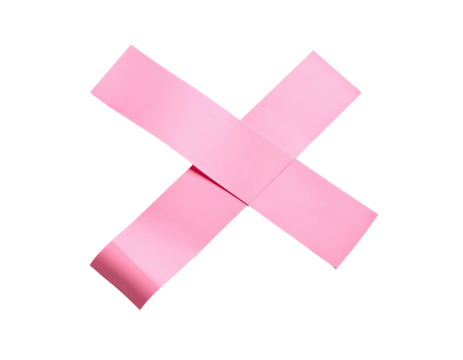 Pink adhesive tape pieces forming a bold "X" against a stark black backdrop