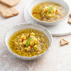 Homemade lentil soup served with basil