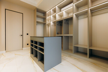 Explore a Modern WalkIn Closet with Minimalist Design and Organized Storage Solutions