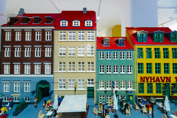 Obraz premium Copenhagen, Denmark 07-20-2025 a display of iconic buildings from the Nyhavn harbour in downtown Copenhagen rebuilt with many Lego blocks.