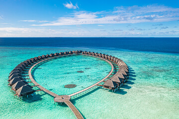 Fantastic aerial Maldives island luxury resort water villas beach tropical sea lagoon bay gorgeous travel landscape exotic paradise summer vacation destination turquoise ocean horizon scenic seascape 