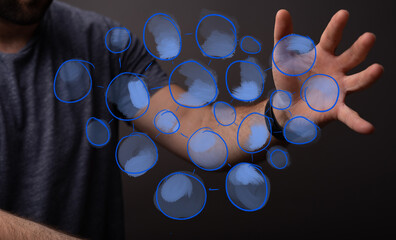 Close-up of a man's hand interacting with a futuristic digital network overlay. Concept of technology, connection, and global communication.