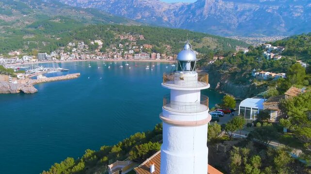 A Scenic Lighthouse that Beautifully Overlooks a Serene Coastal Bay Landscape and View Port Soller