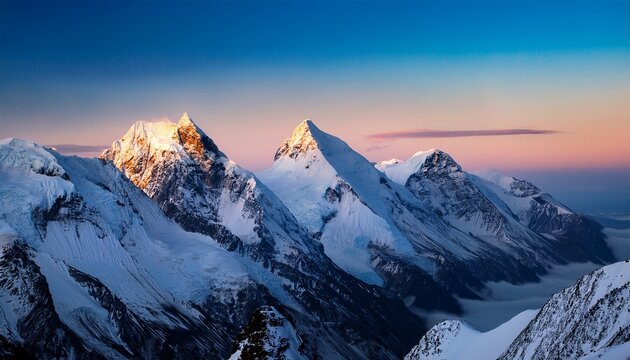 Snow Covered Mountain Peaks At Dawn