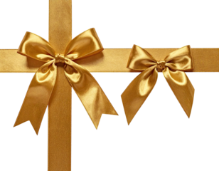 Golden ribbon gift wrap with two bows against a black background