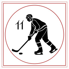 Obraz premium Black hockey player with number 11 on white ice hockey