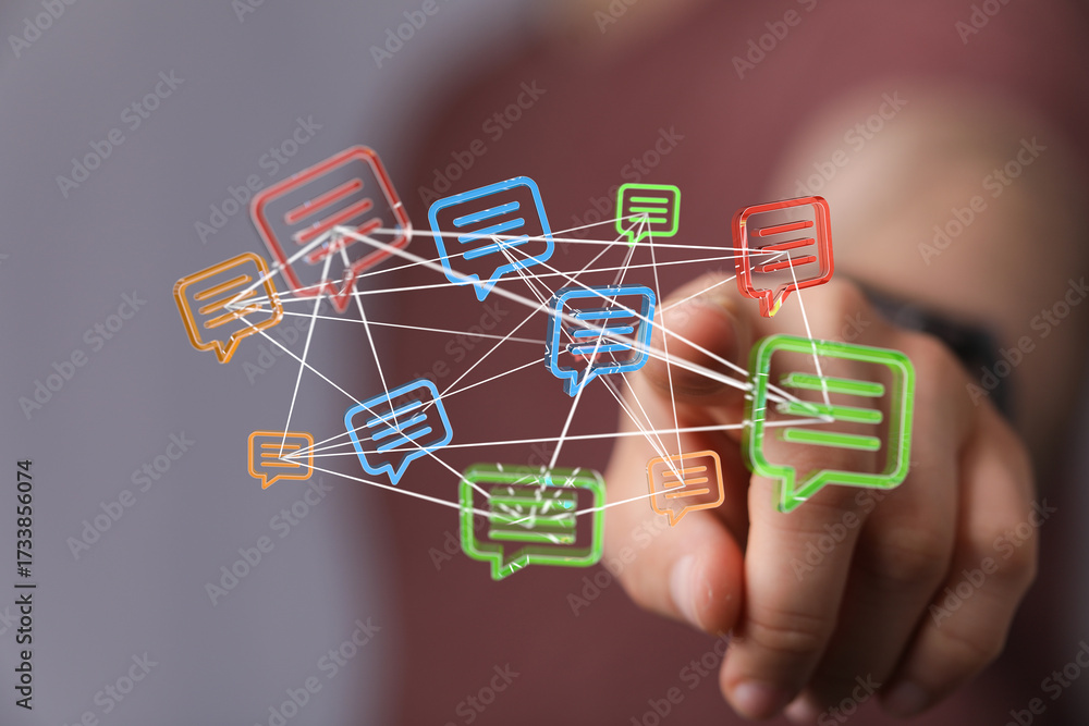 Wall mural a person interacting with a network of digital message bubbles, representing communication and conne